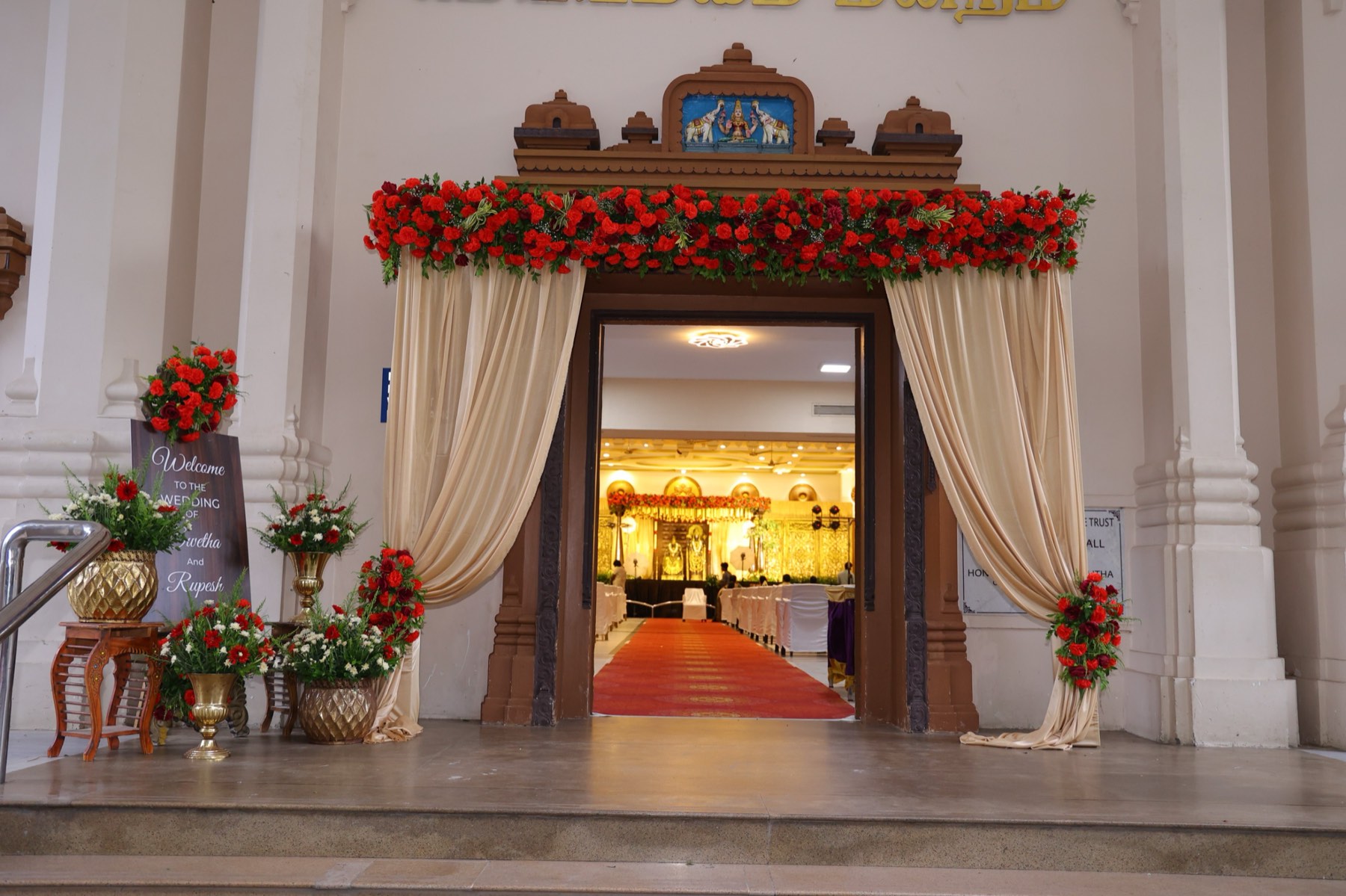 Floral temple-style entrance decor by House of Muhurtam